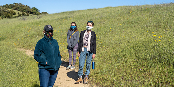 women wearing face coverings on trail