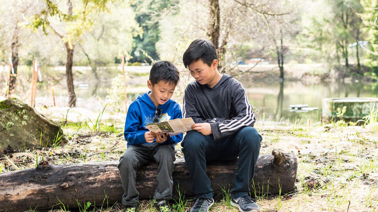 kids looking at a map