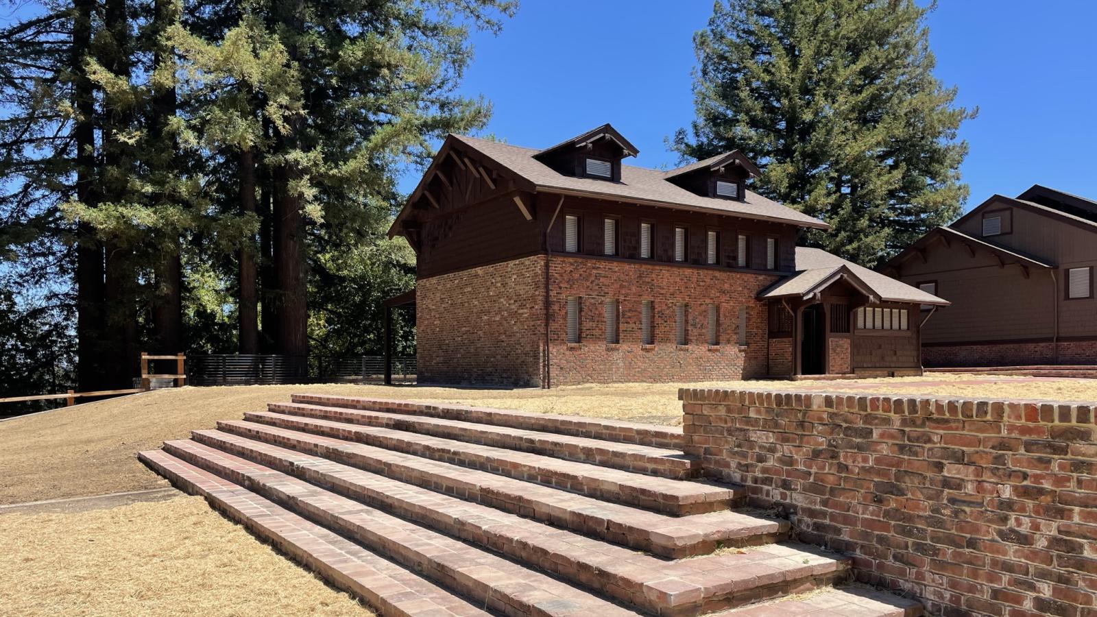 a brick stairway leading up to restored buildings