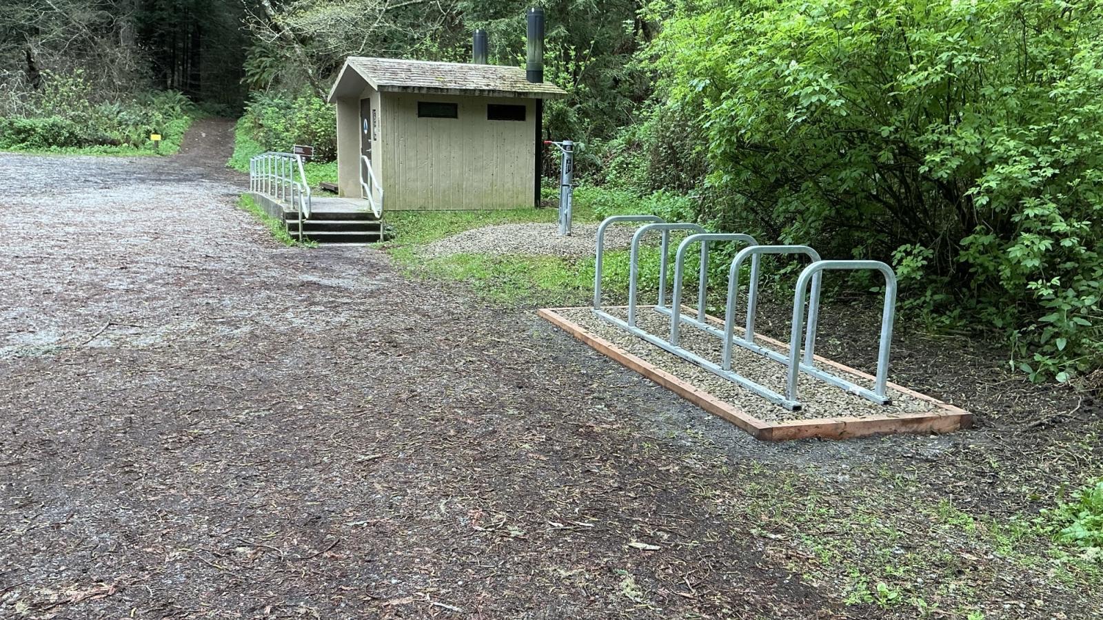 New corral-style bike rack with space for up to 10 bikes located near the restroom at the Purisima Creek Road Parking Area