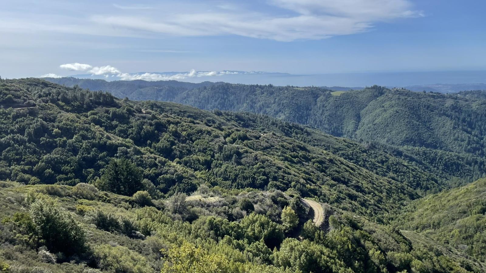 A view of a property added to Sierra Azul Preserve with green hills