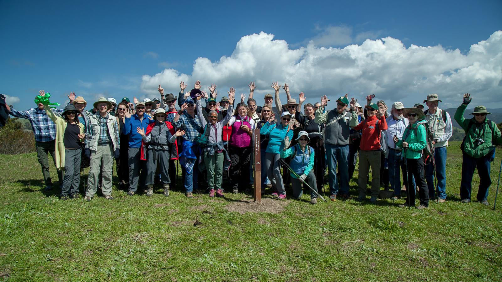 Group of people gathered on a hilltop