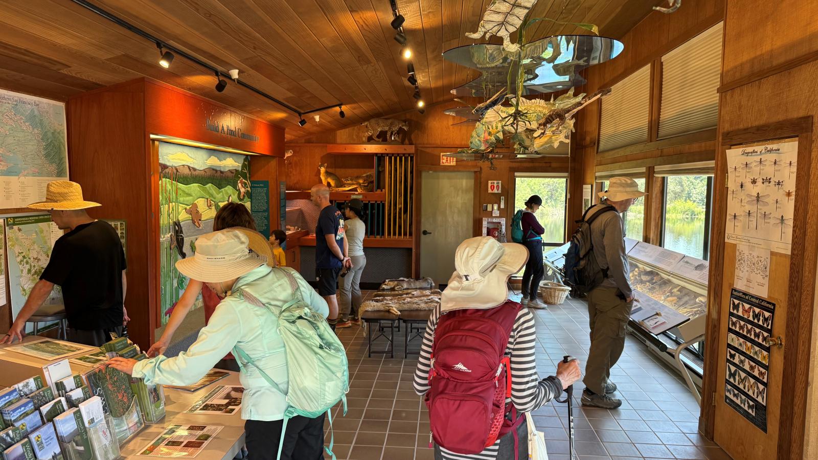 Visitors to the Daniels Nature Center take a look at interactive exhibits and brochures