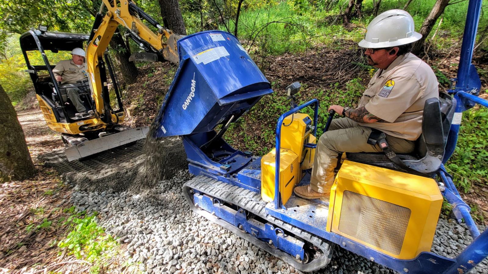 Midpen trail crew use construction equipment to build a trail