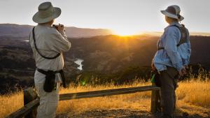 Hikers watching sunrise / photo by Bill Adams