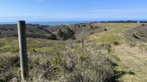 A fence in a field at Cloverdale Ranch Open Space Preserve