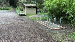 New corral-style bike rack with space for up to 10 bikes located near the restroom at the Purisima Creek Road Parking Area
