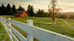 The red barn and a white fence in La Honda Creek Preserve.