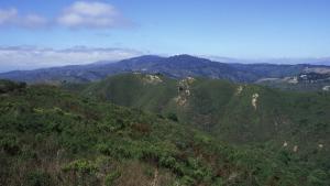 A vista of green, grass-covered hills