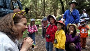 kids and parents laughing on a walk