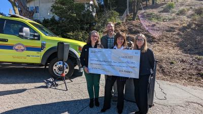 Ana Ruiz, Josh Hugg, Jackie Speier, Deborah Hirst holding check