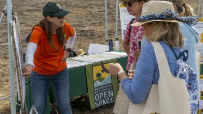 Planner Gretchen Laustsen shares current project information with visitors at Midpen's 50th anniversary Coastside Community Celebration in Half Moon Bay on September 10.