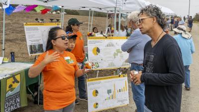 Planning Manager Jane Mark shares information about current projects during Midpen's 50th anniversary Coastside Community Celebration in Half Moon Bay on September 10. (Jack Owicki)