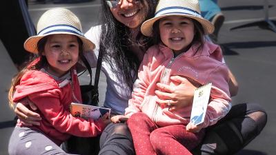 A family with provided nature field guides in-hand helped celebrate the Midpeninsula Regional Open Space District's 50th anniversary on April 30 at the Bayside Family Festival in Midpen's Ravenswood Open Space Preserve near East Palo Alto. (Mishaa DeGraw)