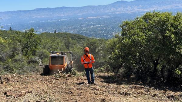 Man uses remote controlled "BurnBot" to conduct ecologically sensitive vegetation removal