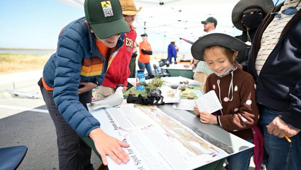 Midpeninsula Regional Open Space District biologist Karine Tokatlian helped visitors to Midpen's Ravenswood Open Space Preserve connect with nature during the Bayside Family Festival April 30. (Leo Leung)