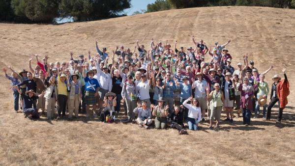 a group of people standing on a hill