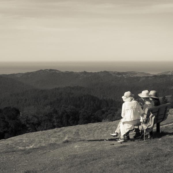 Wallace Stegner Memorial Bench Women sitting on bench at Long Ridge Preserve