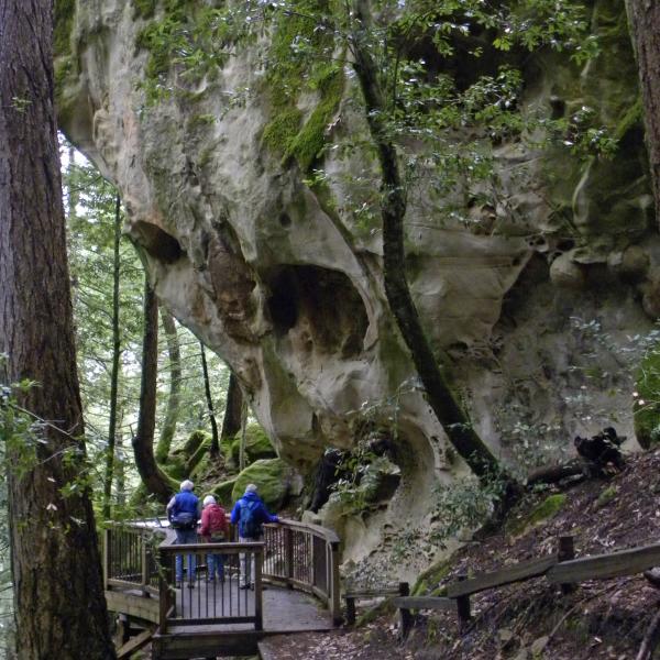 Preserve visitors at the Tafoni rock formation in El Corte de Madera Creek Preserve. (Sandra Martin