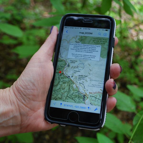 hand holding a smart phone displaying a mapp